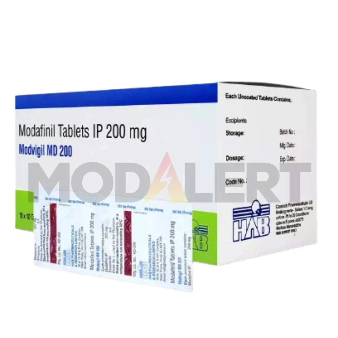 Modvigil MD 200 UK photograph showing Modvigil MD 200mg modafinil tablets carton and printed blister strips.